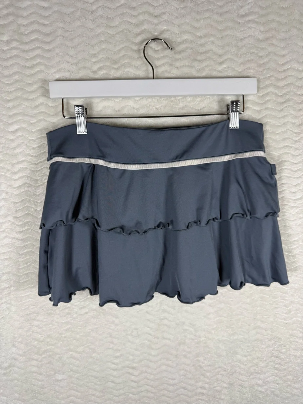 Nike Women's Gray Ruffle Tennis Skort with Contrast Trim. Look good on the court